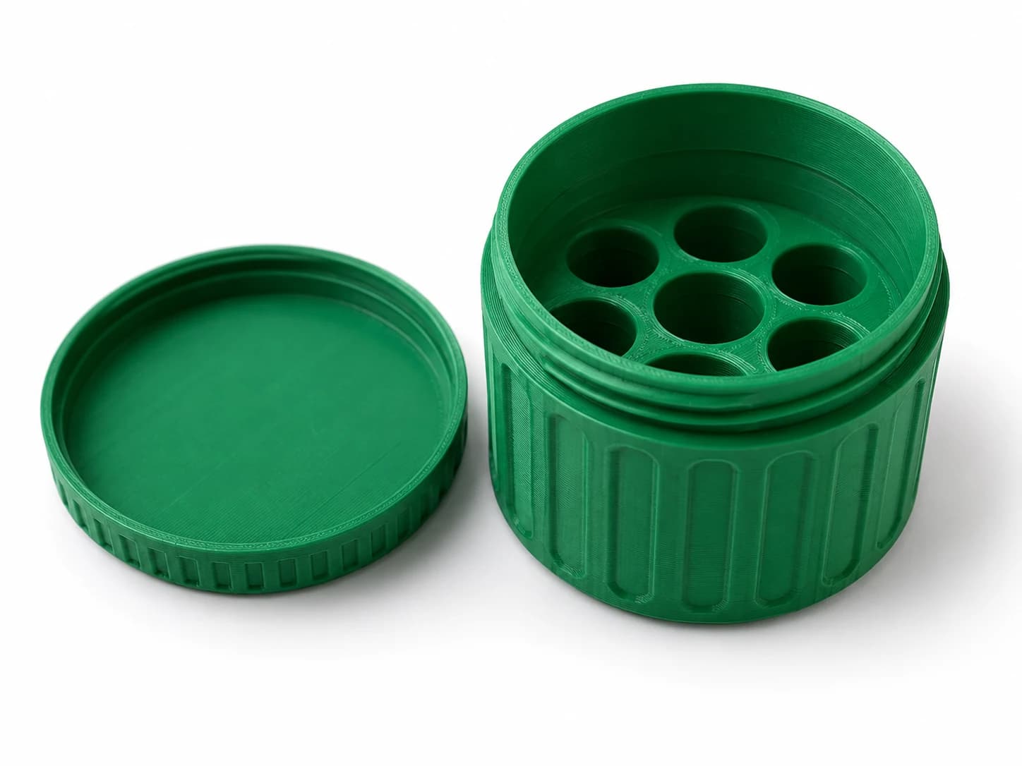 Green 3D-printed Stash Jar with its threaded lid off, showing seven round vial bays