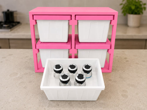 White and pink 3D-printed storage rack with four 5-vial totes and five vials shown