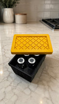 Black 3D-printed five-vial tote with a yellow textured lid